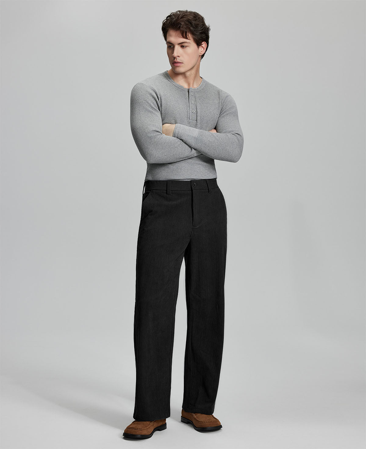 Model in gray sweater with black wide-leg corduroy pants, showcasing casual yet neat daily wear styling.