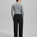 Back view of black wide-leg corduroy pants, showing overall silhouette and rear pocket design for comfort and style.