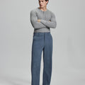 Model in gray sweater with blue wide-leg corduroy pants, showcasing casual yet neat daily wear styling.