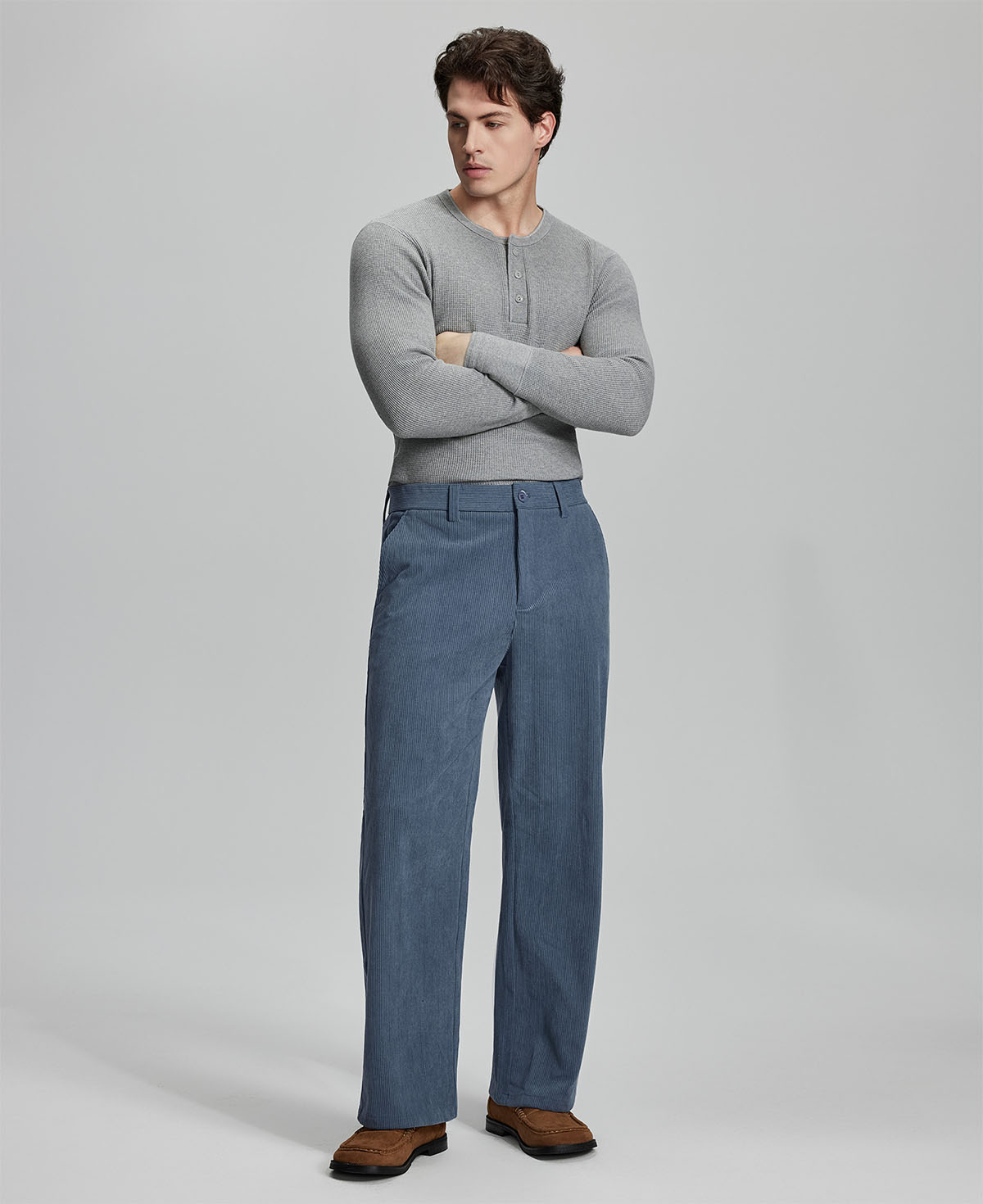 Model in gray sweater with blue wide-leg corduroy pants, showcasing casual yet neat daily wear styling.