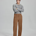 Model in gray sweater with brown wide-leg corduroy pants, showcasing casual yet neat daily wear styling.