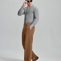 Side view of model wearing sunglasses with brown wide-leg corduroy pants, highlighting loose fit and style adaptability.