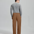 Back view of brown wide-leg corduroy pants, showing overall silhouette and rear pocket design for comfort and style.