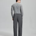 Back view of dark grey wide-leg corduroy pants, showing overall silhouette and rear pocket design for comfort and style.