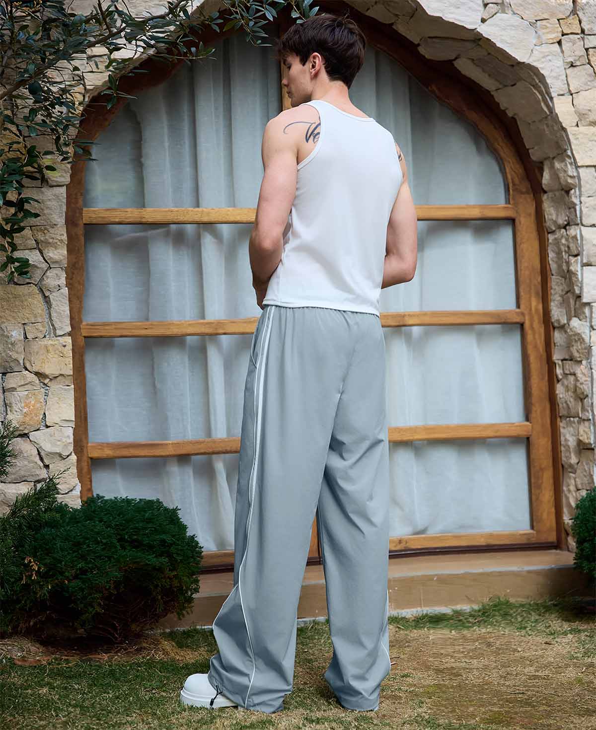 Adjustable drawstring at the hem of lake blue baggy wide leg sweatpants, showing stitching details and fabric texture.