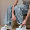 Custom fabric for men's lake blue baggy wide leg sweatpants, windproof exterior, breathable and quick-dry interior.